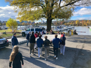 Rowers carrying a piece of dock at Columbia Island Marina