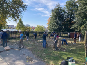 Crew team members spreading gravel at CIM to prepare for boat racks 