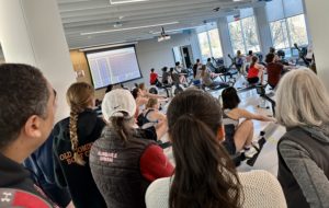 Spectators watching erg race at W-L Crew triathlon.