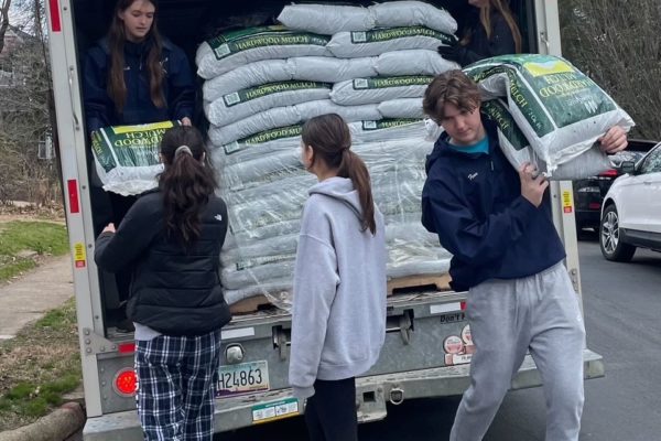 Students delivering mulch